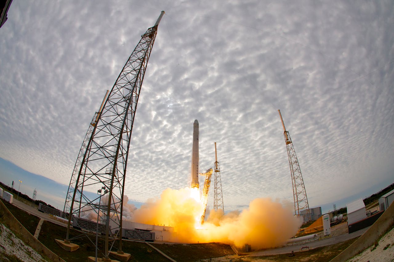 Wide angle of space station during liftoff of rocket after countdown against cloudy sky